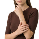 AMOR women's bracelet, stainless steel with gold IP plating, worn by model