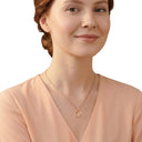 AMOR women's Y-necklace, stainless steel with gold IP plating, worn by model