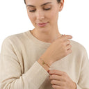 AMOR women's bracelet, stainless steel with silver and gold IP plating, bright pink, worn by model
