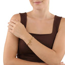 AMOR unisex bracelet, stainless steel with gold IP plating, worn by model