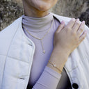 NOELANI women's bracelet, stainless steel with gold IP plating, worn by model