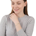 Women's bracelet with charm, worn by model