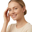 Women's charm hoop earrings, worn by model