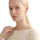 AMOR women's hoop earrings, rhodium-plated 925 sterling silver, worn by model